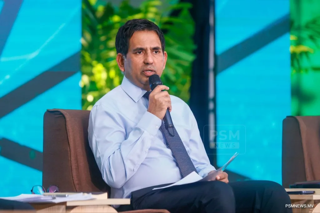 Economic Minister Mohamed Saeed speaking at a press event
